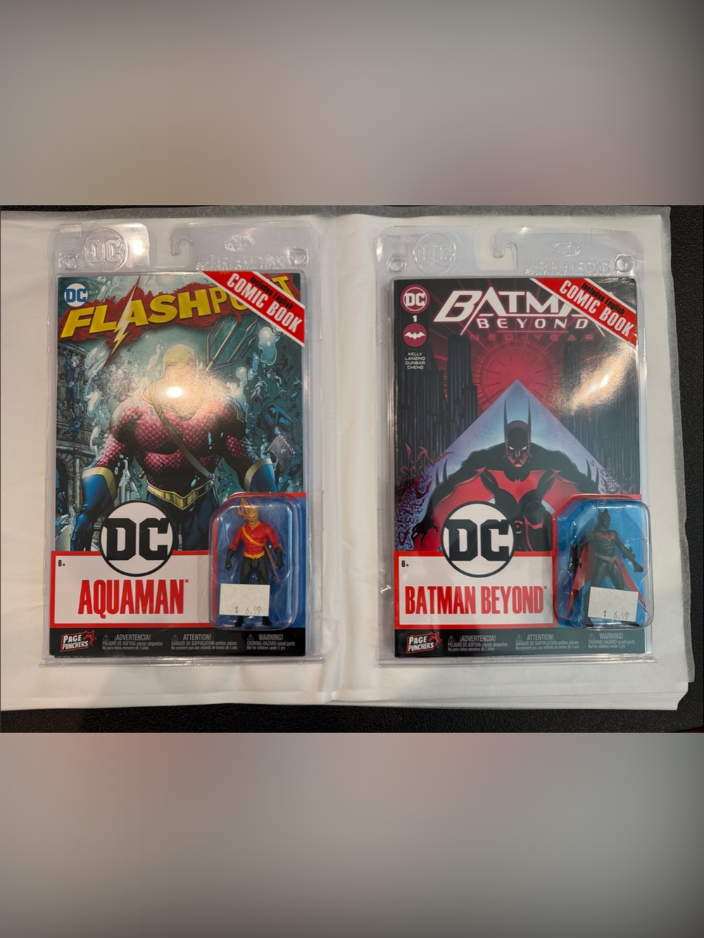 Set of 2 DC comics with action figures.